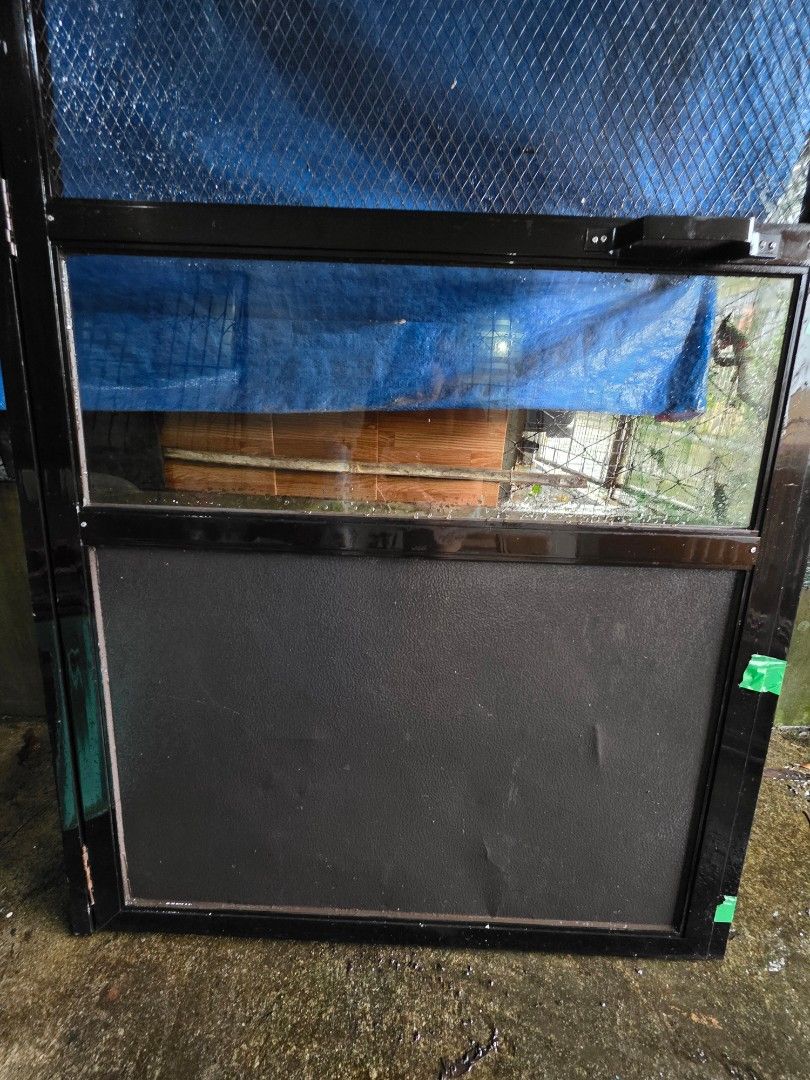 Brown Aluminum Screen Door (Category: Locks, Doors & Gates) located in Quezon City. Submitted by anakai (Listing ID 1395918675, Image 2). Description: - Brown aluminum screen door - Features mesh screen and solid lower panel - Includes glass panel on the side - Suitable for exterior use - Ready for installation with Hamba.