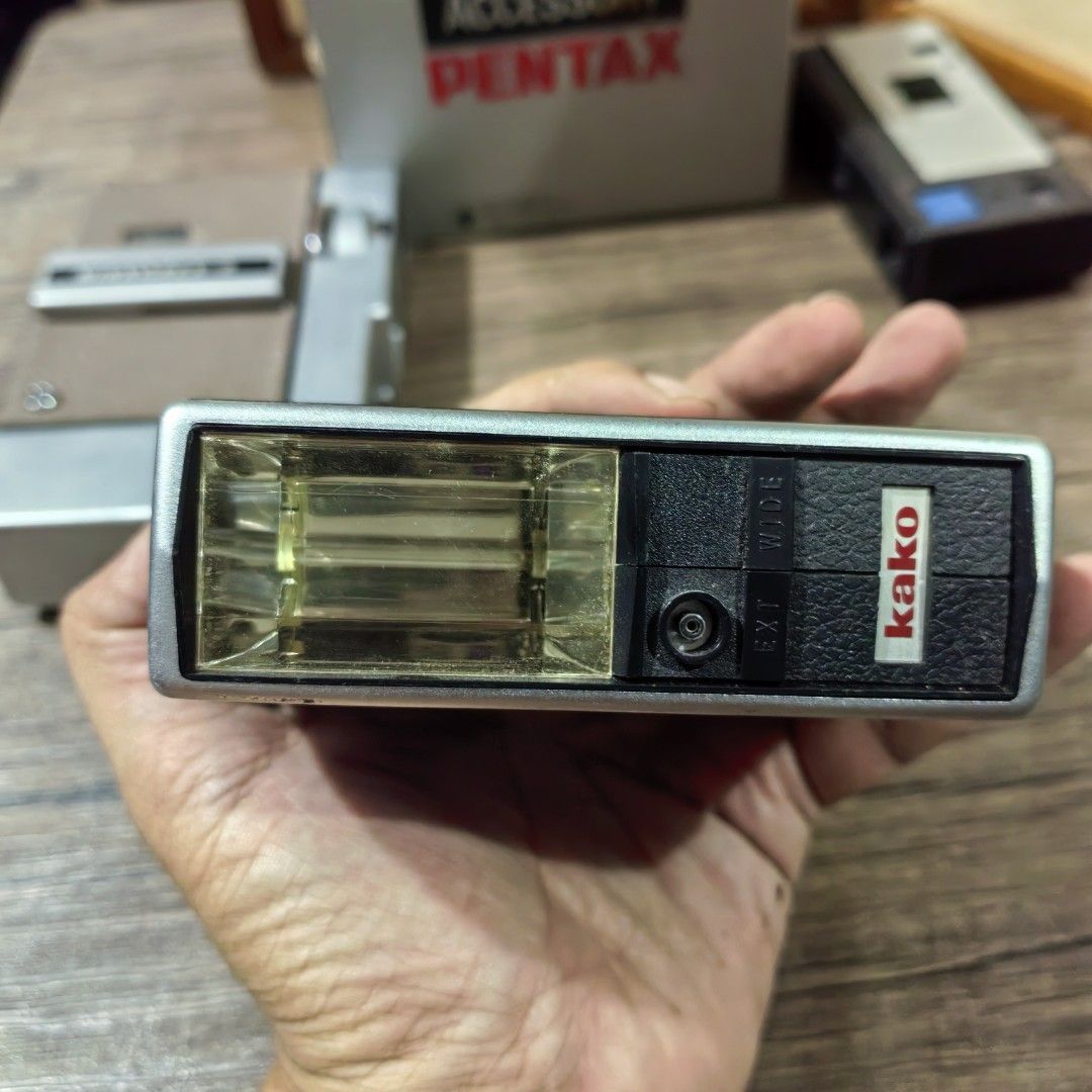 Camera Flash Kako Auto-250S Series Cut-Off System (Category: Flashes) located in Cebu City. Submitted by dudes_villanueva (Listing ID 1395921537, Image 1). Description: Camera Flash Kako Auto-250S Series Cut-Off System. Note: Untested. Sold as is. All sales final and non-refundable. 📌This is a vintage flash unit, likely made in Japan during the 1980s. 📌It's part of the Auto-250S series and features a cut-off system. 📌The flash is compatible wi