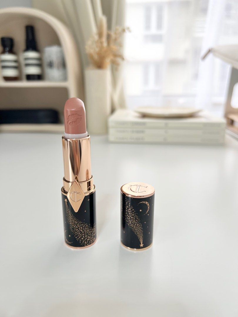 Charlotte Tilbury JK Magic Lipstick (Category: Makeup) located in Taguig. Submitted by carmellouise (Listing ID 1395803088, Image 1). Description: - 95% left - Comes with its box packaging - Charlotte Tilbury JK Magic lipstick in a black and gold starry design. - nude color..