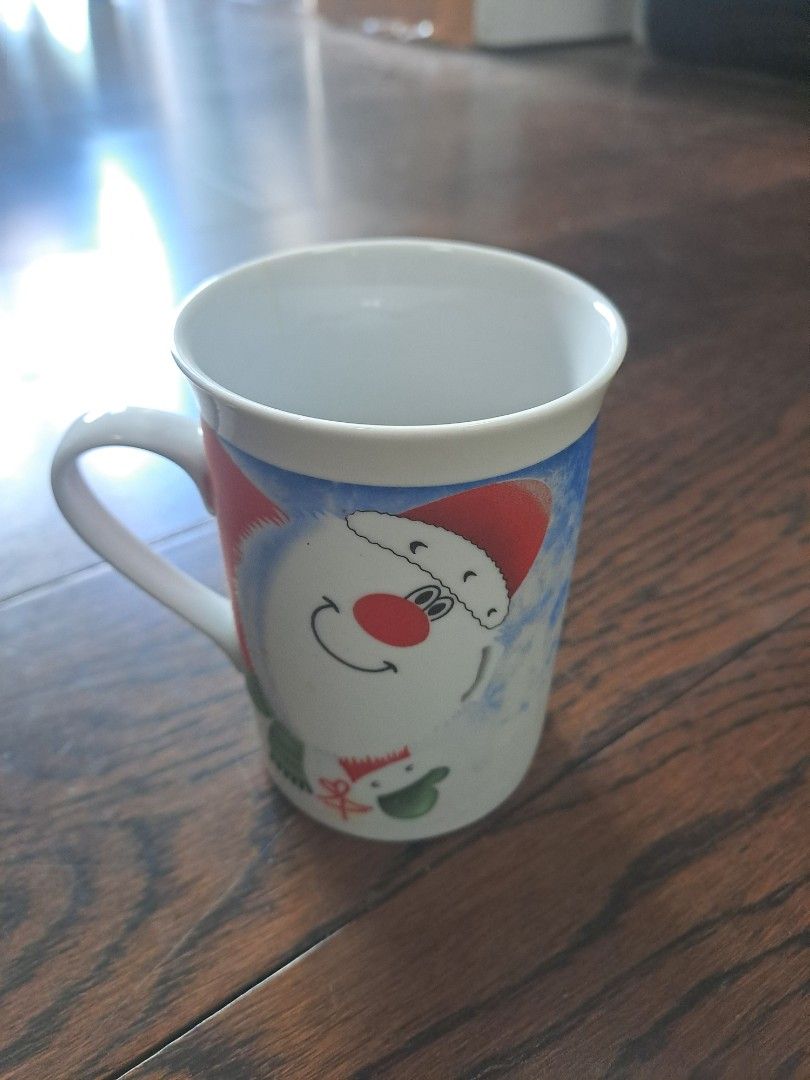 Christmas Themed Mug (Category: Coffee & Tea Tableware) located in Manila. Submitted by joanbalde39643 (Listing ID 1395834518, Image 2). Description: - Christmas-themed mug - Features a Santa Claus design - White handle and interior - Made of ceramic - Ideal for hot beverages.