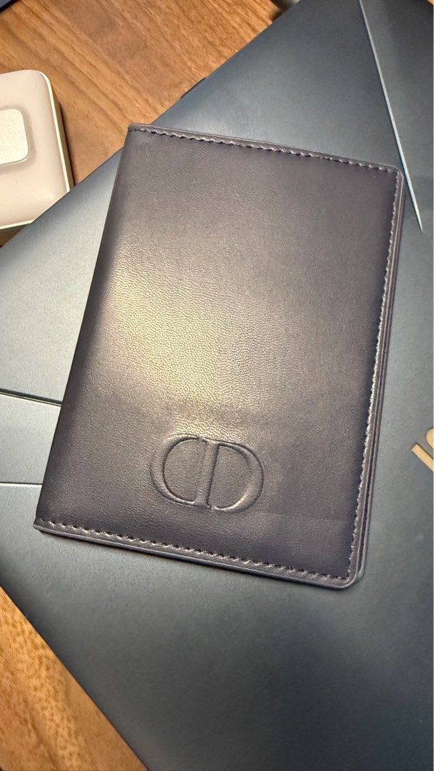 Dior Beauté Passport Holder (Category: Luxury Bags & Wallets) located in Bacolod City. Submitted by sneaks31 (Listing ID 1395766615, Image 2). Description: - Authentic Dior Beauté Passport Holder - Dark exterior with CD logo - Interior card slots - Smooth material - Stitched border for durability - Embossed Dior Beauté logo inside .