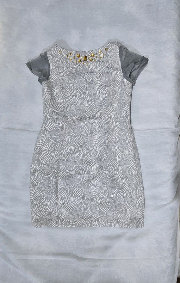 Embellished Bodycon Dress (Category: Dresses) located in Mandaluyong City. Submitted by 1hapimaki (Listing ID 1395840616, Image 1). Description: - Bodycon dress - Unique pattern - Jewel-embellished neckline - Short sleeves - Neutral color - Versatile.
