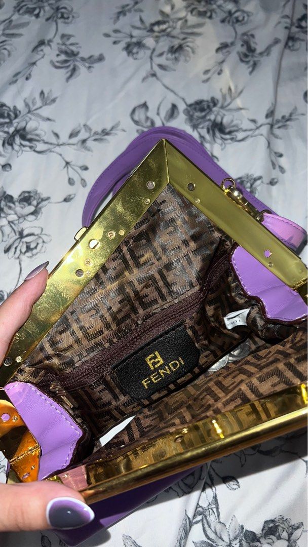 Fendi First Purple Shoulder/Sling Bag (Category: Luxury Bags & Wallets) located in Quezon City. Submitted by watchyoursteff (Listing ID 1395737120, Image 3). Description: - Fendi shoulder bag (OFF) - Vibrant purple exterior - Gold-toned frame - Signature Fendi logo print interior - Includes shoulder/sling strap - Clasp closure RFS: decluttering, too many bags.