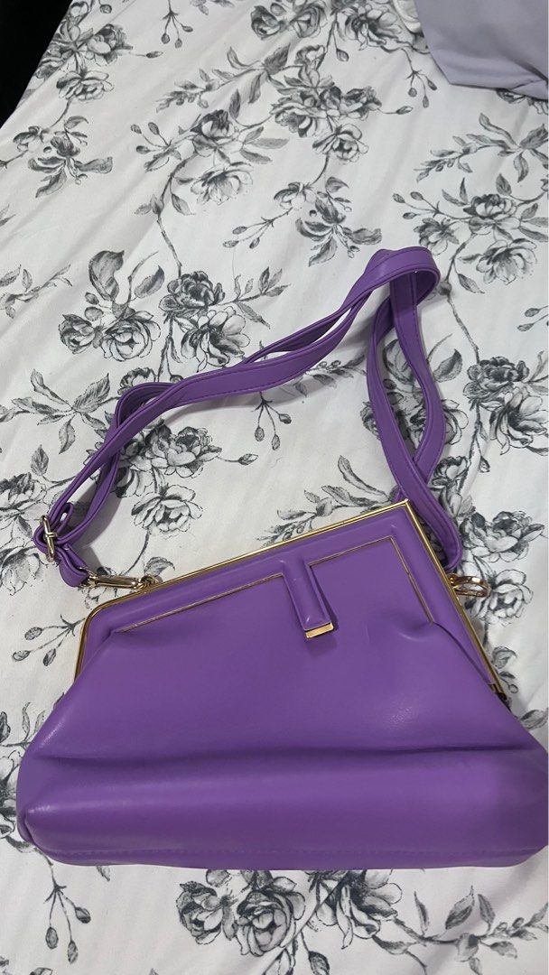 Fendi First Purple Shoulder/Sling Bag (Category: Luxury Bags & Wallets) located in Quezon City. Submitted by watchyoursteff (Listing ID 1395737120, Image 1). Description: - Fendi shoulder bag (OFF) - Vibrant purple exterior - Gold-toned frame - Signature Fendi logo print interior - Includes shoulder/sling strap - Clasp closure RFS: decluttering, too many bags.