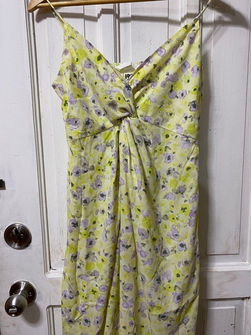 Floral Print Spaghetti Strap Dress (Category: Dresses) located in Cavite. Submitted by dumpxpotato (Listing ID 1395778239, Image 1). Description: - Floral print dress in yellow and purple - Spaghetti strap design - Twisted bust detail - Made of lightweight fabric - Comfortable fit - Ideal for warm weather.