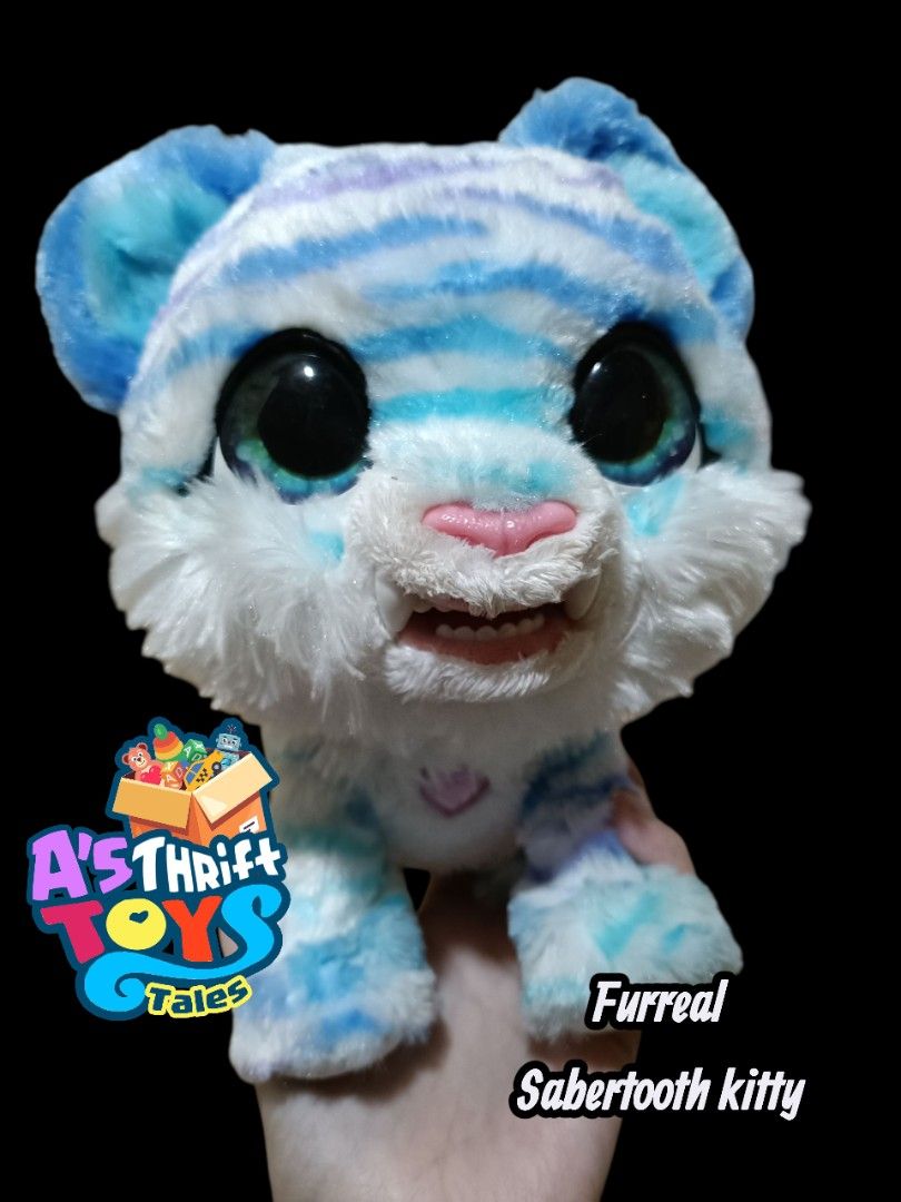 Furreal Sabertooth Kitty Plush Toy (Category: Plushies & Soft Toys) located in Iligan City. Submitted by shehabdor98515 (Listing ID 1395922124, Image 1). Description: -interactive toy -moving ang mouth.