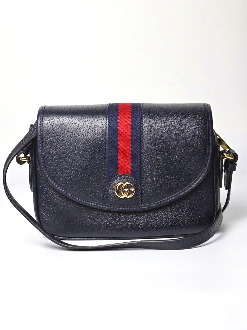 Gucci Small Ophidia Blue Shoulder Bag (Category: Luxury Bags & Wallets) located in Pandi. Submitted by luximperium (Listing ID 1395750431, Image 3). Description: Colors: Blue Includes: Dust Bag, Detachable Canvas & Web Straps, Care Card Material: Blue Leather Canvas (Exterior), Fabric (Interior) Size: Small Dimensions: L (23cm), H (15cm), W (6cm), S (Leather: 139cm–adjustable, Web: 103cm–adjustable) Closure & Pockets: Flap closure with magnetic s