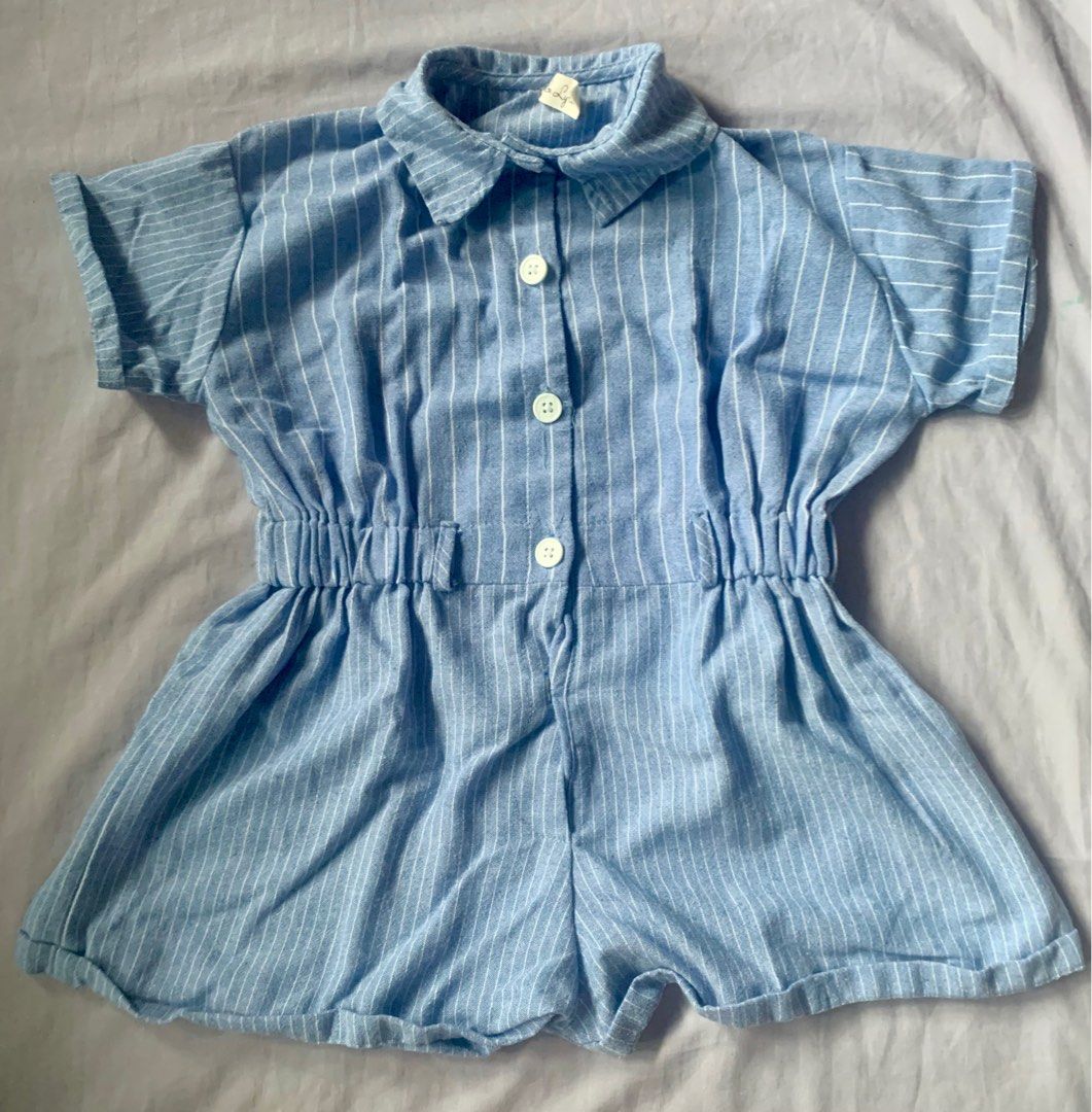 Laila & Lyla Striped Romper s5 (Category: Babies & Kids Fashion) located in Legazpi City. Submitted by ZaiasBootek (Listing ID 1395921297, Image 2). Description: Adorable romper from Laila & Lyla. Features a blue and white striped pattern. It has short sleeves, a collared neckline, and a button-down front. The waist is elasticated. Perfect for a casual and comfortable look. Made from a lightweight fabric, ideal for warm weather..
