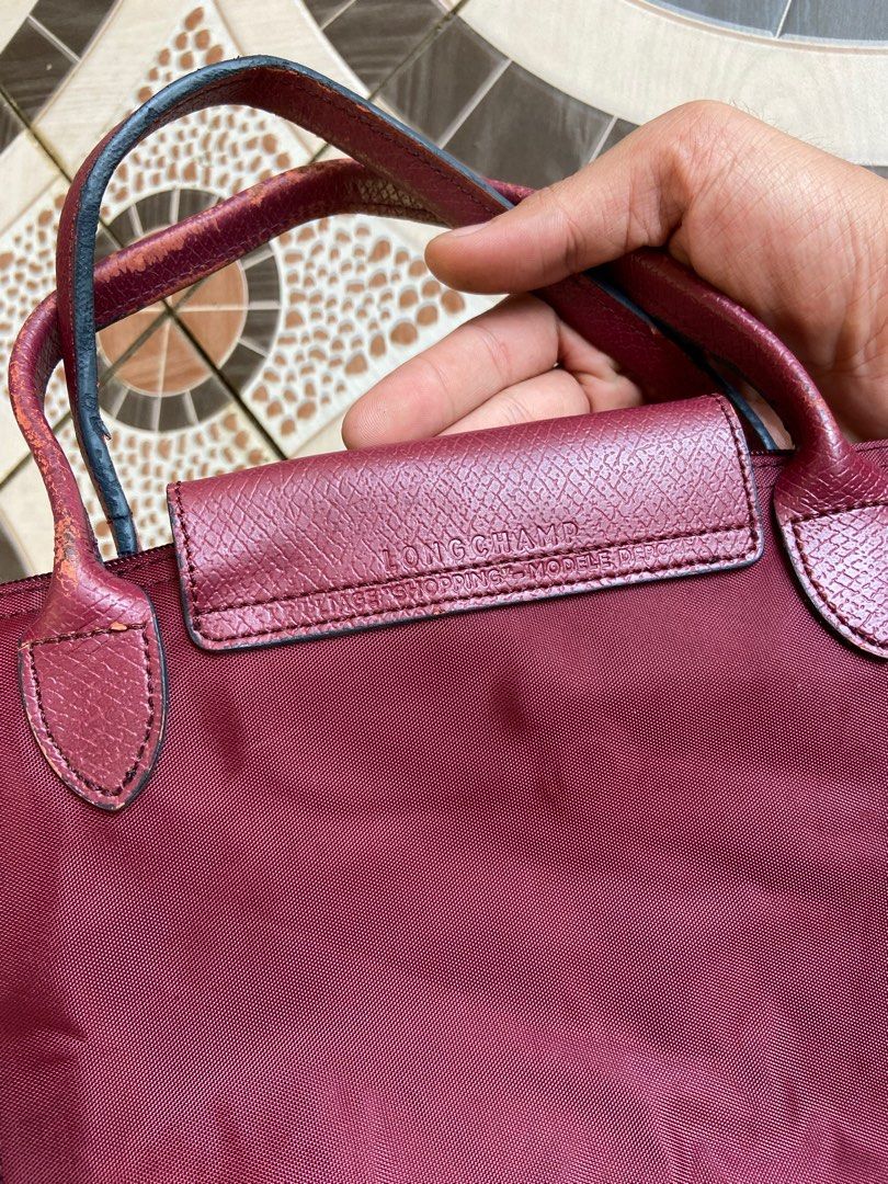 Longchamp Le Pliage Burgundy Small (Category: Luxury Bags & Wallets) located in Davao. Submitted by payts.wruh (Listing ID 1395818857, Image 3). Description: ▪️Longchamp Le Pliage Burgundy Small Goodcolor rate Issue: Handle/ See last photo Pm me if interested 📩 📍Davao city.