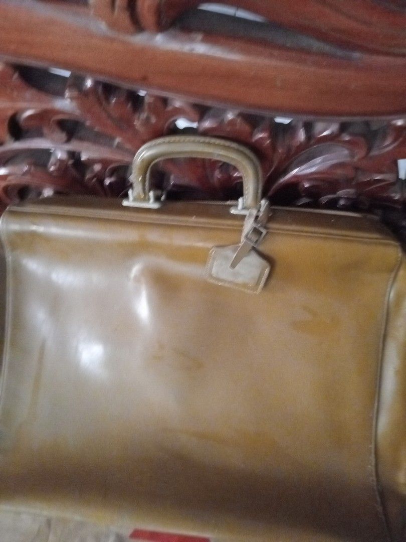 Maruem Suitcase - Made in Japan (Category: Luggage) located in Manila. Submitted by padillahe35291 (Listing ID 1395749233, Image 3). Description: - Vintage Maruem suitcase - Brown exterior - Features a handle and tag - Interior lined with lighter brown fabric - Includes straps and compartments - Zipper closure - Made in Japan.