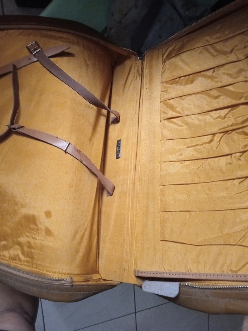 Maruem Suitcase - Made in Japan (Category: Luggage) located in Manila. Submitted by padillahe35291 (Listing ID 1395749233, Image 2). Description: - Vintage Maruem suitcase - Brown exterior - Features a handle and tag - Interior lined with lighter brown fabric - Includes straps and compartments - Zipper closure - Made in Japan.