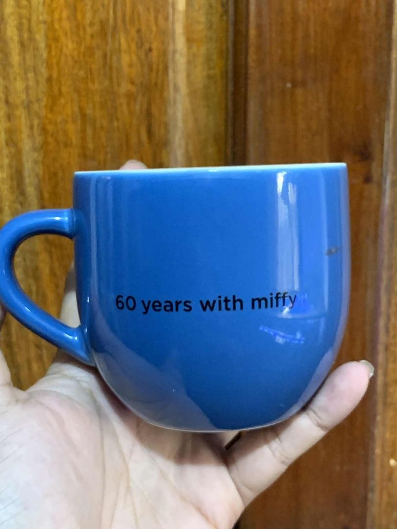 Miffy 60 Years Anniversary Mug (Category: Coffee & Tea Tableware) located in Manila. Submitted by jkaye890 (Listing ID 1395829042, Image 3). Description: - Miffy 60th Anniversary Mug - Blue exterior with Miffy design - Features "60 years with miffy" text - Interior Miffy illustration - Comfortable handle - Never Used (Japan Surplus).