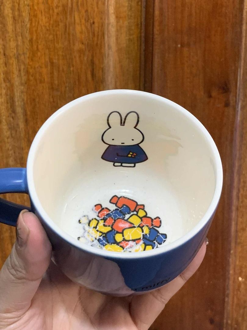 Miffy 60 Years Anniversary Mug (Category: Coffee & Tea Tableware) located in Manila. Submitted by jkaye890 (Listing ID 1395829042, Image 2). Description: - Miffy 60th Anniversary Mug - Blue exterior with Miffy design - Features "60 years with miffy" text - Interior Miffy illustration - Comfortable handle - Never Used (Japan Surplus).