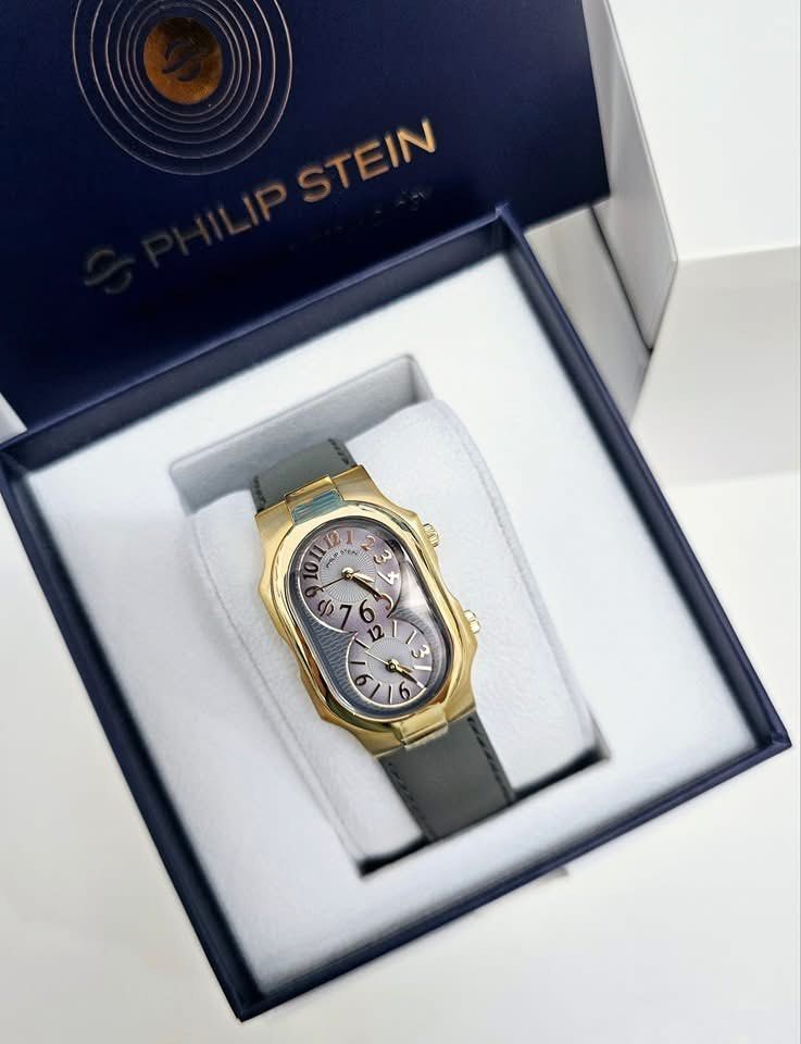 Philip Stein Dual Time Zone Watch Small (Category: Luxury Watches) located in Pateros City. Submitted by omniabeautyph. (Listing ID 1395821362, Image 1). Description: - Philip Stein watch - Dual time zone display - Gold-tone case - Gray leather strap - Comes with original box - Perfect for any occasion.