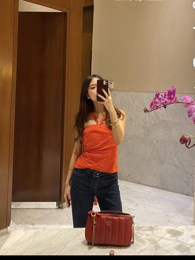 Scarlet Overlap Sleeveless Top (Category: Sleeveless) located in Manila. Submitted by j_decluttering (Listing ID 1395841561, Image 1). Description: - got on ig for 550 - wore it once only - actual ww pics posted - fits M-L if you wear it normally (first pic) - fits S as a halter top (see second pic) - super nice for the summer, very vibrant reddish orange.