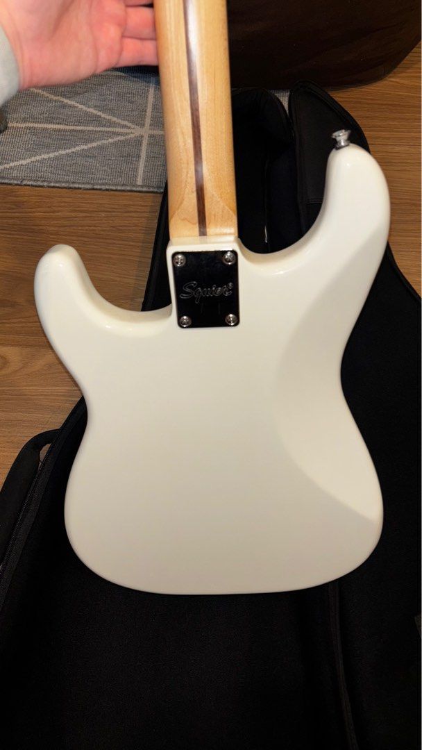 Squier Stratocaster by Fender (Category: Musical Instruments) located in Pasig City. Submitted by unwanteditemsfrommycloset (Listing ID 1395765307, Image 3). Description: 🔥used but not abused 🔥tried to learn how to play but gave up after 3 months… never used it since 🔥no hidden issues 🔥comes with fender cords (with extra cord), fender strap, and capo rfs: not in use anymore:( Pm if interested!!.