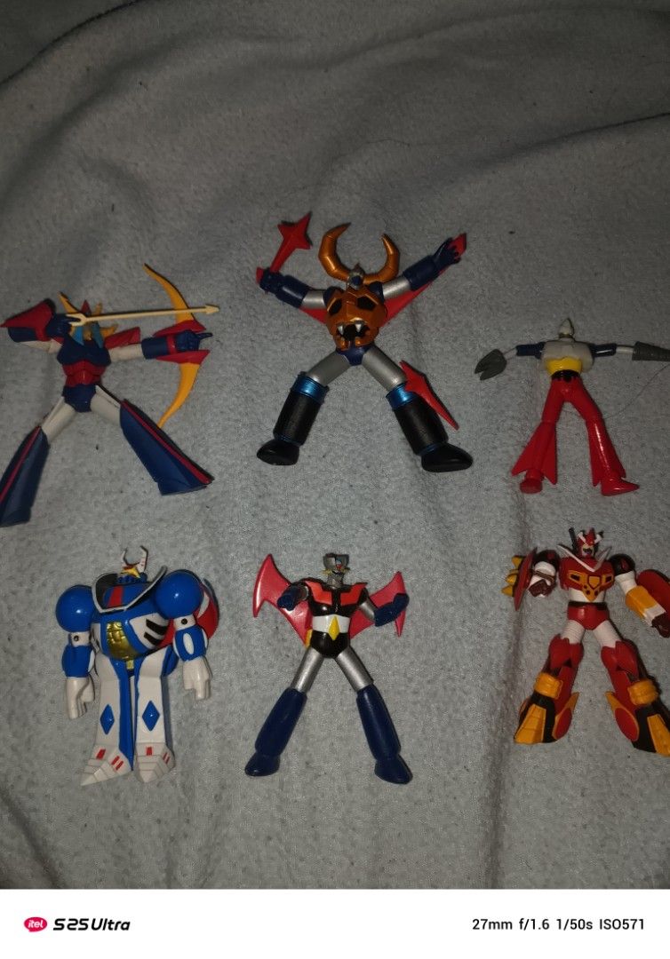 Vintage Robot Action Gashapon Figures (Category: Figurines & Statues) located in Manila. Submitted by marcus42 (Listing ID 1395844448, Image 1). Description: - Vintage robot action figure set. - Features various robot designs. - Includes different colors and accessories.mazinger z-400,mekanda-400,brave reideen-300,getter 2-200,gaiking -250,Pegas of Tekkaman fame -150 - Some figures have unique features like wings and bows. - Made of plastic. - Gr