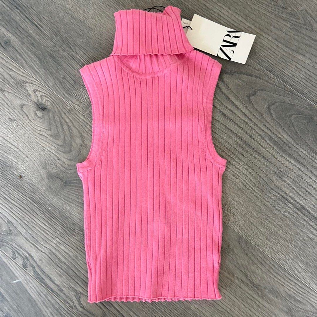 Zara Sleeveless Turtleneck Top PINK (Category: Sleeveless) located in Antipolo. Submitted by articlesbyeve (Listing ID 1395804139, Image 1). Description: - Zara pink sleeveless turtleneck top - Size S - Ribbed knit design - High neckline - Fitted silhouette - Made in Bangladesh - Perfect for layering.