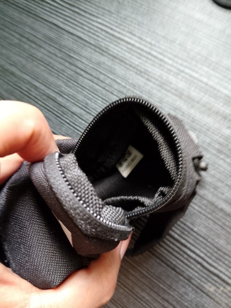 Original Adidas Black Pouch with Carabiner (Category: Purses & Pouches) located in Quezon City. Submitted by osaki.drew (Listing ID 1397459332, Image 3). Description: - Adidas black pouch with Eco Bag - Features the Adidas logo - Small front pocket - Zipper closure - Carabiner clip for easy attachment - Durable fabric - Interior tag - Can use as Bag charm, Coin Purse or Earphone Case..