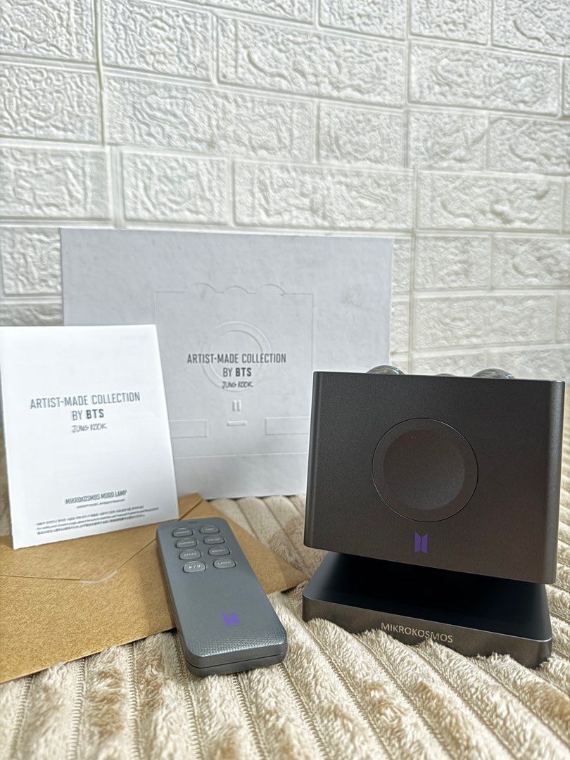 BTS Jungkook Mikrokosmos Mood Lamp (Category: K-Wave Merchandise) located in Valenzuela. Submitted by cheskeyk.1 (Listing ID 1397440023, Image 1). Description: - Artist-Made Collection by BTS Jungkook Mikrokosmos Mood Lamp - Includes: Lamp, Remote Control, Instruction Manual, and Packaging - Packaging features BTS logo and "Artist-Made Collection by BTS Jungkook" - Lamp design: Sleek and modern - BTS logo on the lamp - sealed envelope (photocard 