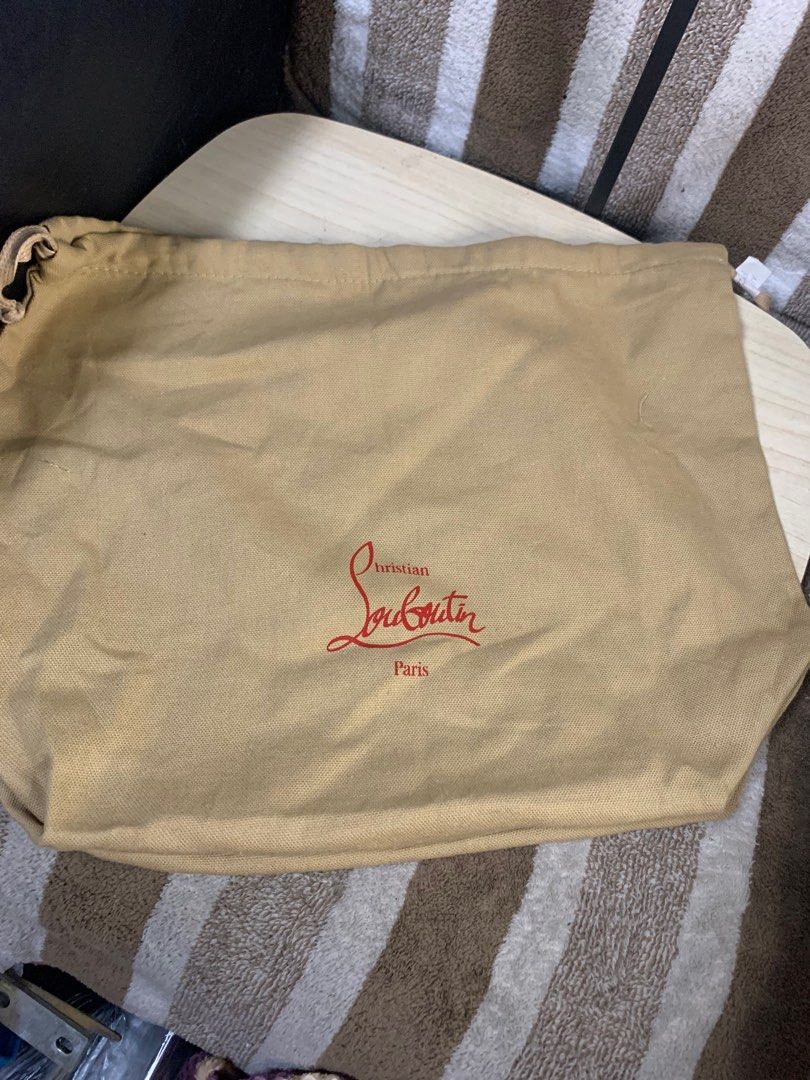 Christian Loubotin dustbag string bag (Category: Luxury Bags & Wallets) located in Cabanatuan. Submitted by mjluxxejapan (Listing ID 1397451156, Image 1). Description: Fixed price. Approx 13”x15” meas like new Orig from japan details posted .