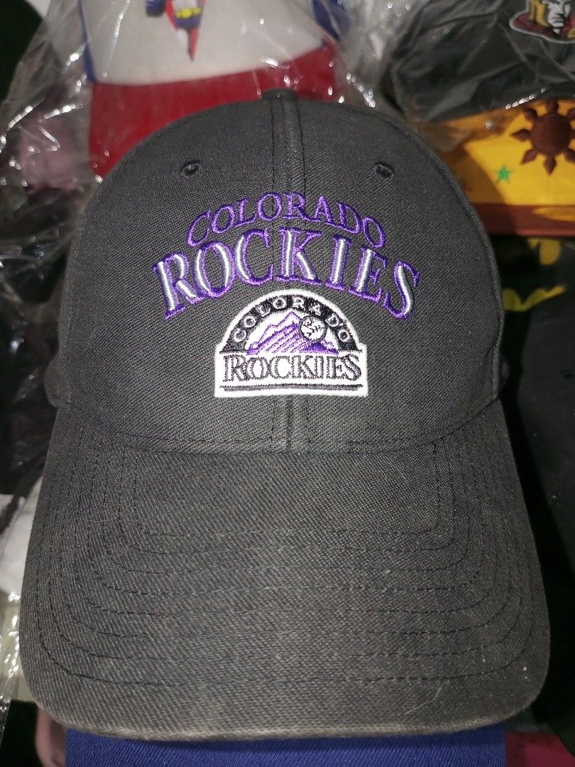 Colorado Rockies Cap (Category: Caps & Hats) located in Subic. Submitted by tonyramo20 (Listing ID 1397551065, Image 1). Description: - Colorado Rockies cap - Black exterior - Purple and white logo - Gray underside of brim - Adjustable strap - Made by Twins Enterprise.