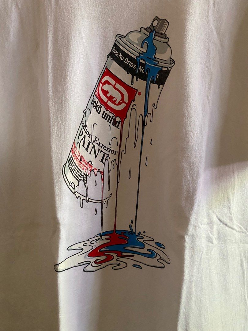 Ecko Unltd. Spray Paint Graphic T-shirt (Category: Tshirts & Polo Shirts ) located in Maribojoc. Submitted by xieee13 (Listing ID 1397527334, Image 2). Description: - White Ecko Unltd. T-shirt - Features a spray paint graphic - Graphic includes the words "PAINT" and "Runs, No Drips, No Mess" - Crew neck and short sleeves - Standard fit - Ecko Unltd. logo visible W-22 L-31.