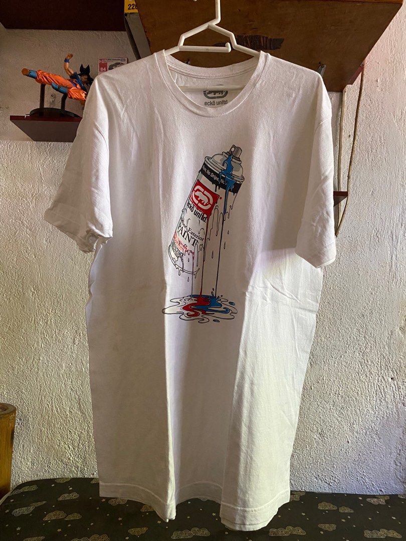 Ecko Unltd. Spray Paint Graphic T-shirt (Category: Tshirts & Polo Shirts ) located in Maribojoc. Submitted by xieee13 (Listing ID 1397527334, Image 1). Description: - White Ecko Unltd. T-shirt - Features a spray paint graphic - Graphic includes the words "PAINT" and "Runs, No Drips, No Mess" - Crew neck and short sleeves - Standard fit - Ecko Unltd. logo visible W-22 L-31.