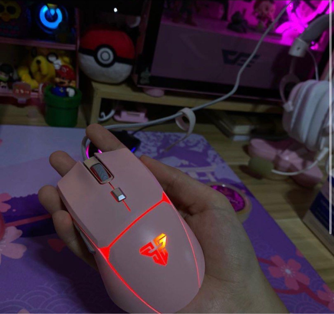 Fantech Pink Gaming Mouse (Category: Mouse & Mousepads) located in Paranaque City. Submitted by noctslivdeclutter (Listing ID 1397513142, Image 1). Description: - Pink Fantech gaming mouse - RGB lighting - Wired connection - Sleek design with Fantech logo - Scroll wheel and multiple buttons for gaming ‼️ Good as new. Bought 3 months ago. RFS: I was gifted a new mouse and I won't use it anymore. This is a good RGB wires gaming mouse that I used in