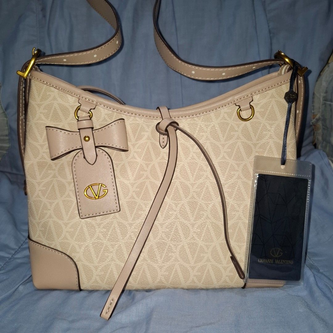 Giovanni Valentino Shoulder Bag (Category: Shoulder Bags) located in Manila. Submitted by mdc08 (Listing ID 1397577260, Image 1). Description: ▪︎Authentic (per source), with tags ▪︎Used once ▪︎Leather material; branded fabric lining ▪︎Gold-toned vintage hardware; brand engraved on zipper pulls ▪︎Main compartment with magnetic closure, 2 open pockets, 2 zippered pockets; detachable pouch (with 1 zippered pocket and 1 open pocket) ▪︎Dimensions: L 2