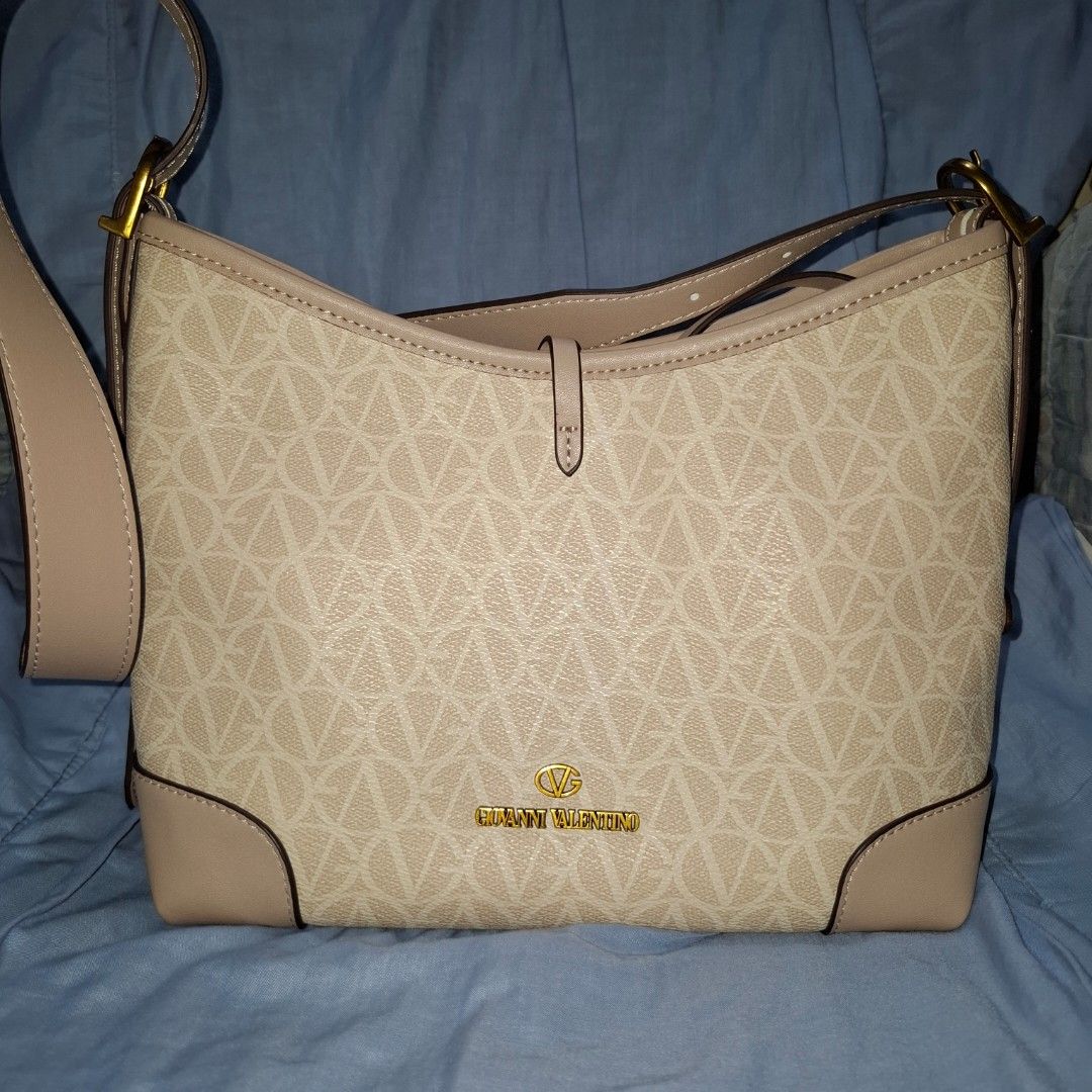 Giovanni Valentino Shoulder Bag (Category: Shoulder Bags) located in Manila. Submitted by mdc08 (Listing ID 1397577260, Image 2). Description: ▪︎Authentic (per source), with tags ▪︎Used once ▪︎Leather material; branded fabric lining ▪︎Gold-toned vintage hardware; brand engraved on zipper pulls ▪︎Main compartment with magnetic closure, 2 open pockets, 2 zippered pockets; detachable pouch (with 1 zippered pocket and 1 open pocket) ▪︎Dimensions: L 2