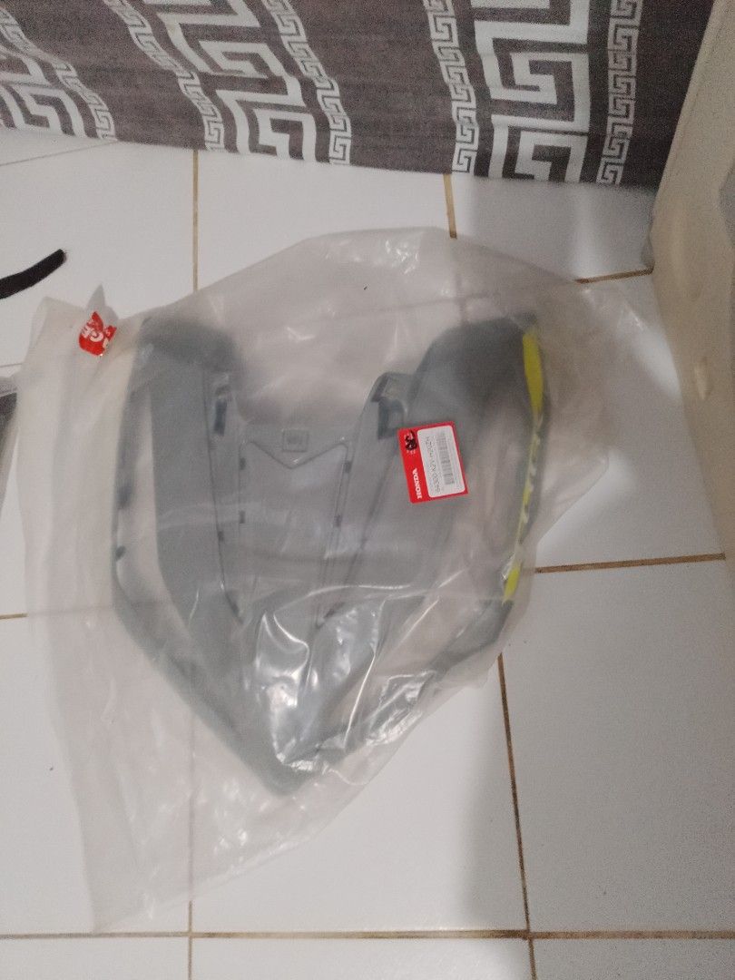 Honda Motorcycle Fairing (Category: Body Parts and Accessories) located in Manila. Submitted by mystictiger-1ff2 (Listing ID 1397556536, Image 1). Description: Genuine Honda motorcycle fairing, still in its original packaging. It has a Honda sticker attached. This part is likely for a specific motorcycle model. Please ensure compatibility before purchasing..