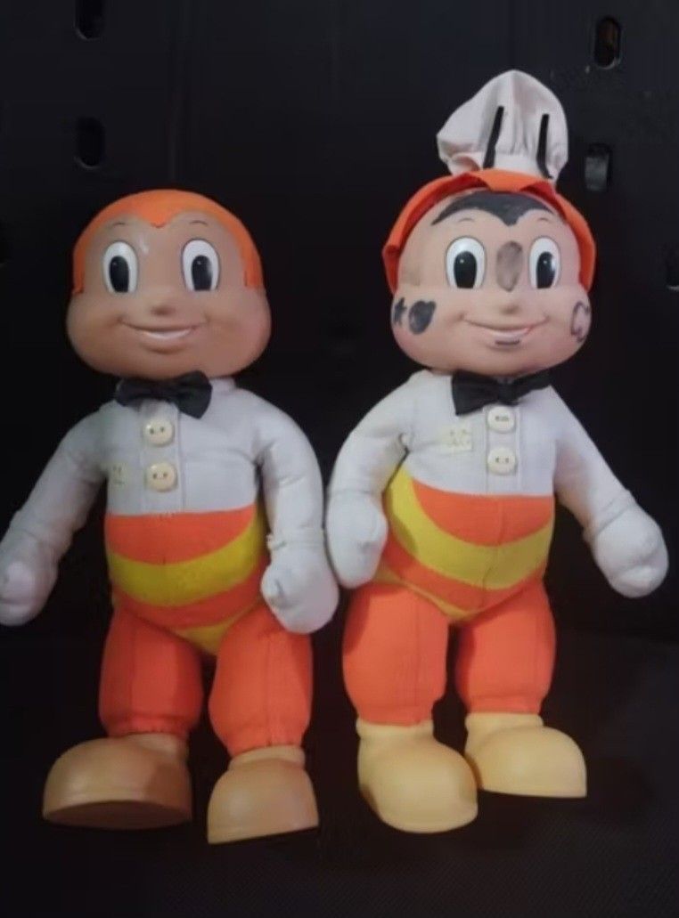 Jollibee Plush Toy Set (Category: Plushies & Soft Toys) located in Abucay. Submitted by g_treasures (Listing ID 1397426433, Image 1). Description: - Set includes two Jollibee plush toys. - One Jollibee is wearing a chef's hat. - Both have orange pants with yellow stripes. - Both have white shirts and black bow ties. - Features tan skin and shoes..
