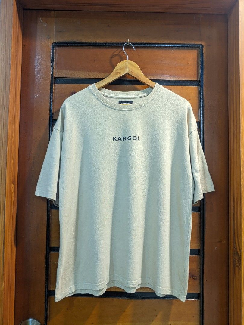 Kangol Beige T-shirt (Category: Tshirts & Polo Shirts ) located in Bansalan. Submitted by chrisdrops (Listing ID 1397566733, Image 1). Description: - Beige Kangol T-shirt - Features Kangol logo (front and back) - Material: 100% cotton - Made in China - Size indicated on tag - Classic and versatile.