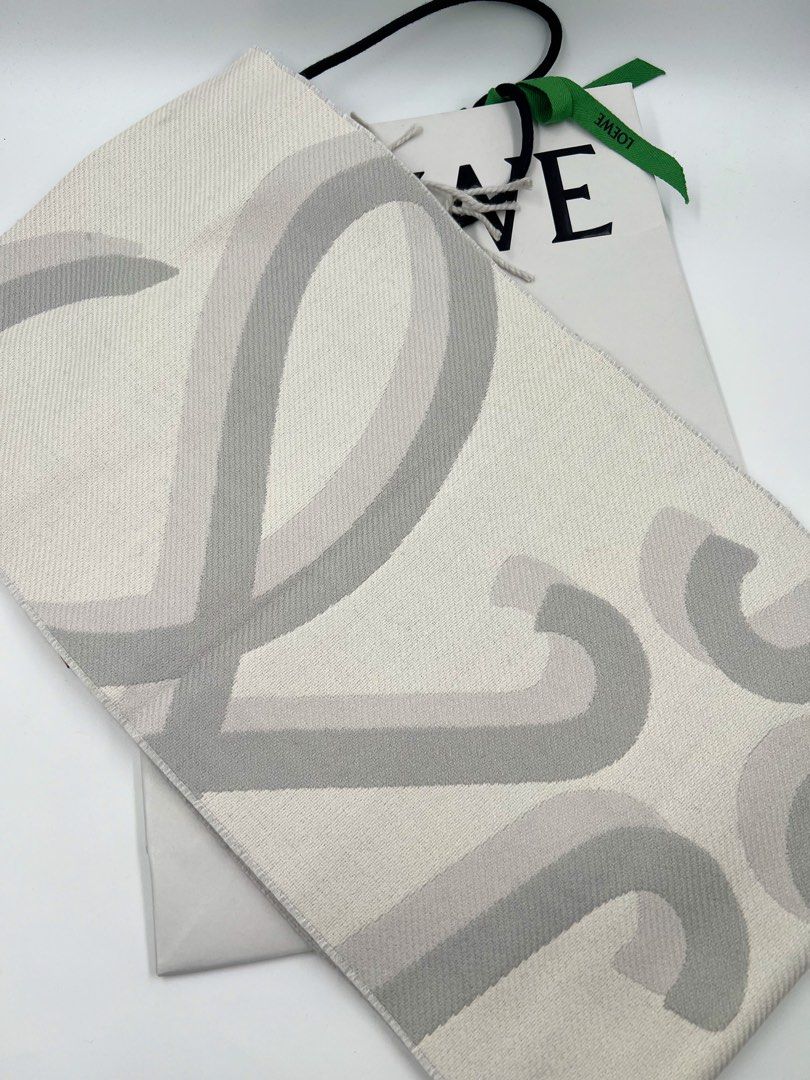 ⚜️Loewe Anagram Fringed scarf (Category: Luxury Accessories) located in Makati City. Submitted by 90sangel (Listing ID 1397573446, Image 2). Description: •Item: Loewe Anagram Fringed Scarf •Size: One size 74" x 10.6" •Condition: Excellent! 💯 *Scarf crafted in medium-weight wool and cashmere blend. Blown-up Anagram jacquard w/ Fringed edges. Anagram embossed placed on the corner. ⚜️ *Very hard to find piece. Japan sourced. 100% 𝒂𝒖𝒕𝒉𝒆𝒏𝒕𝒊𝒄