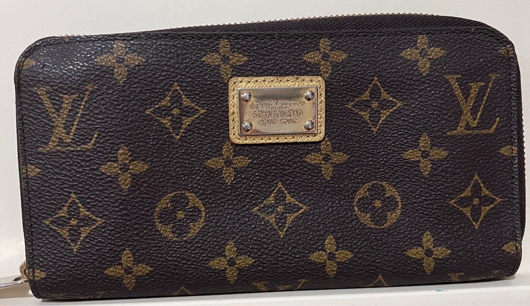 LV Zippy Wallet (Category: Luxury Bags & Wallets) located in San Fernando. Submitted by klutzy_kloset (Listing ID 1397418365, Image 1). Description: For sale: LV Wallet featuring the iconic monogram canvas exterior, gold interior lining, multiple compartments and card slots. It has an engraved Louis Vuitton 5 Canton Road Hong Kong plate on the front. Issues: This was bought at a vintage shop so expect signs of use. No leather peeling but interior