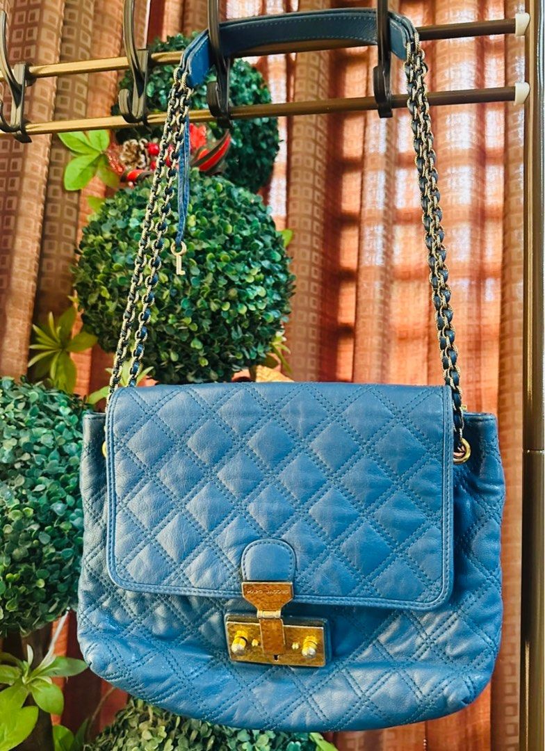 Marc Jacobs Blue Quilted Leather Shoulder Bag (Category: Luxury Accessories) located in San Pablo. Submitted by donaya_luxe (Listing ID 1397413173, Image 2). Description: - Authentic Marc Jacobs shoulder bag - Quilted design - Vibrant blue color - Chain strap - Secure clasp closure - can fit your Promax and other girls stuff.