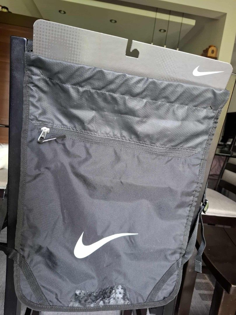 Orig Nike Drawstring Bag (Category: Backpacks) located in Binan City. Submitted by monnit (Listing ID 1397426090, Image 1). Description: Black Nike drawstring bag. Features a front zippered pocket and a large main compartment. Includes adjustable straps. The Nike logo is visible on the front. Perfect for carrying gym essentials or everyday items. Bought in Nike Japan Price 650 Location Jubilation Binan Laguna Shipping Buyers expense.
