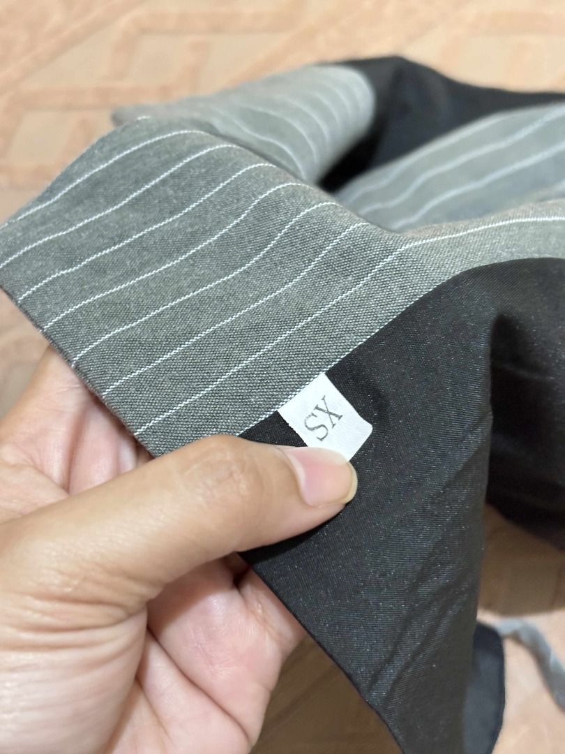 Pinstripe Vest XS (Category: Sleeveless) located in Manila. Submitted by warmwolf-e864 (Listing ID 1397453252, Image 2). Description: - Gray pinstripe vest - Size: XS - Reversible design with black lining - Features tie straps - Three-button closure RFS : Decluttering Note : - No issue - Slightly used (once only).