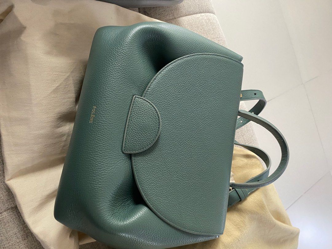 Polène Numéro Sept Handbag (Category: Luxury Bags & Wallets) located in Quezon City. Submitted by secondstreeet (Listing ID 1397454965, Image 3). Description: - Polène Numéro Sept handbag - Stunning teal color - Features a top handle and detachable shoulder strap - Comes with a dust bag - Elegant flap closure - Luxurious gold-toned hardware - Structured design - Spacious interior Polene Bag 29,000 Barely used.