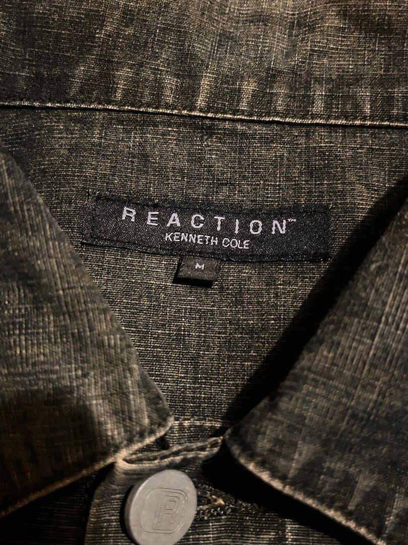 Reaction Kenneth Cole Denim Acid Wash Jacket (Category: Coats, Jackets and Outerwear) located in San Juan City. Submitted by lzip888 (Listing ID 1397530464, Image 2). Description: - Reaction Kenneth Cole denim jacket - Medium size - Dark wash - Classic design - Button closures - Multiple pockets - Reaction logo buttons - Perfect for layering.