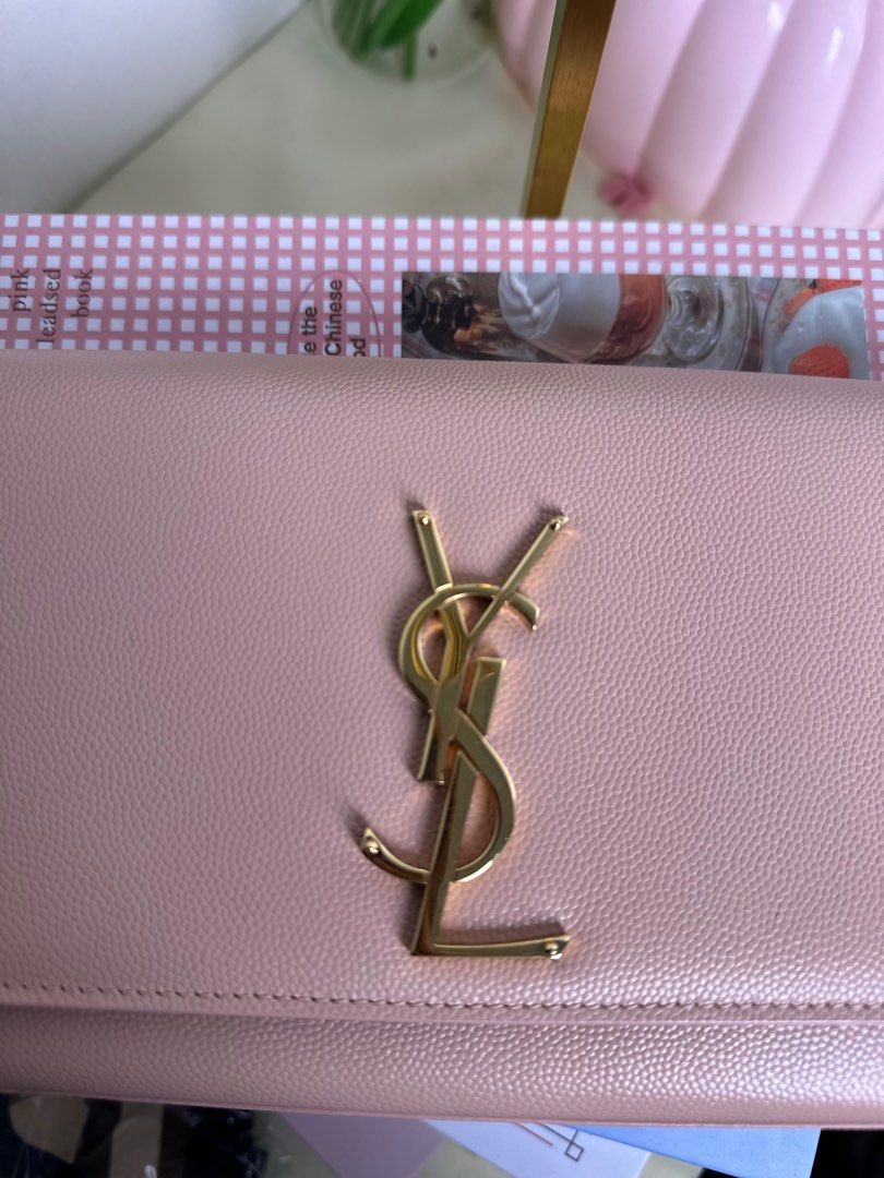 Saint Laurent YSL Sac Cassandre Clutch (Category: Luxury Bags & Wallets) located in Cagayan de Oro. Submitted by thecdobags (Listing ID 1397563191, Image 2). Description: - Authentic Saint Laurent clutch - Soft pink color - Gold YSL logo - Black interior - Includes authenticity cards and receipt - Made in Italy.