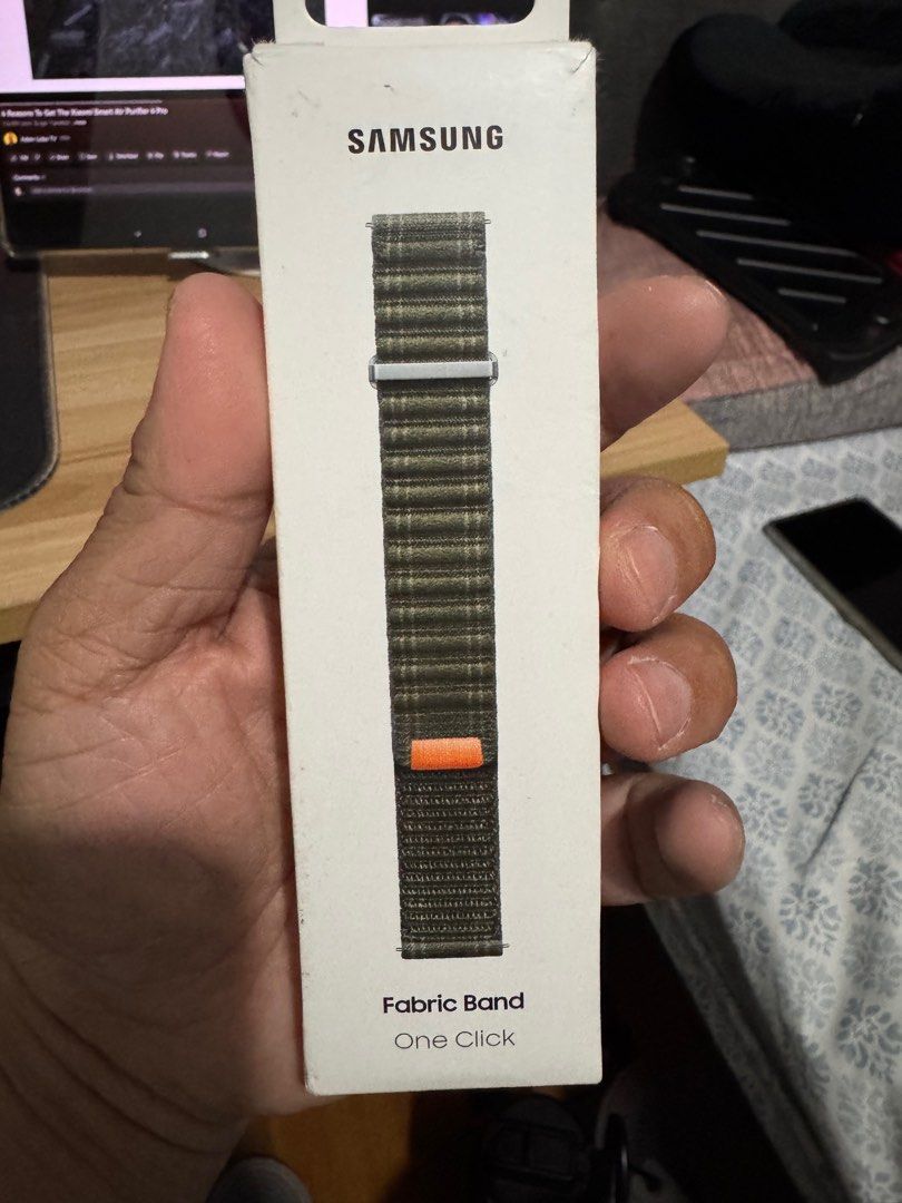 Samsung Fabric Band (Category: Wearables & Smart Watches) located in Angeles City. Submitted by celestialbody (Listing ID 1397575717, Image 2). Description: - Genuine Samsung fabric band - Green and brown plaid design - Easy one-click attachment - Brand new in original packaging.