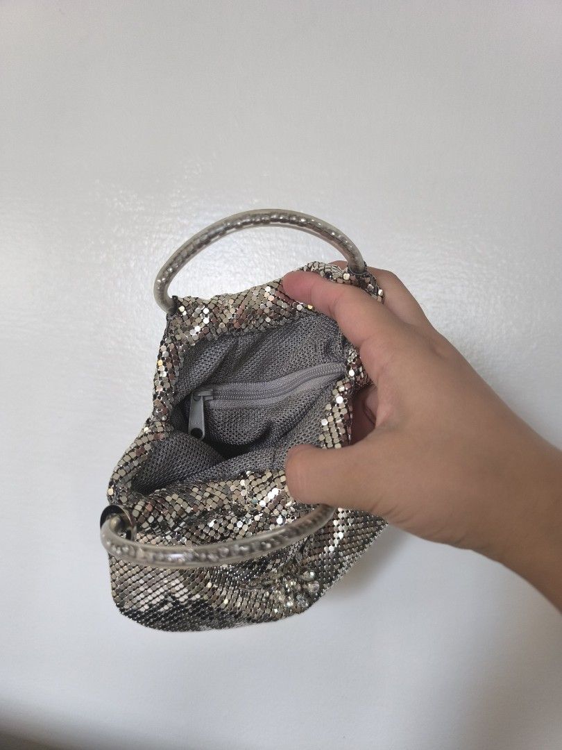 Silver Mesh Handbag with Handle (Category: Luxury Bags & Wallets) located in Naga. Submitted by janetteku18158 (Listing ID 1397422711, Image 3). Description: Silver mesh handbag features a unique design with a handle. It has a zippered interior for securing belongings. The bag's exterior is made of small, interconnected metal pieces, creating a shimmering effect. The handle is a matching silver color. It's a stylish accessory for various occasion