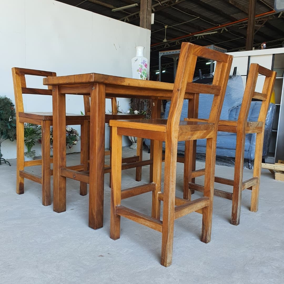 Solid Wood Rectangular 4-Seater Bar Table (Category: Tables & Sets) located in Shah Alam. Submitted by unearthstore (Listing ID 1397481038, Image 3). Description: "Bring rustic charm and lasting durability to your dining or entertainment space with this solid wood rectangular bar table set, complete with 4 matching high chairs. Crafted from solid wood, this set offers a natural finish and sturdy build, perfect for both casual dining and entertain