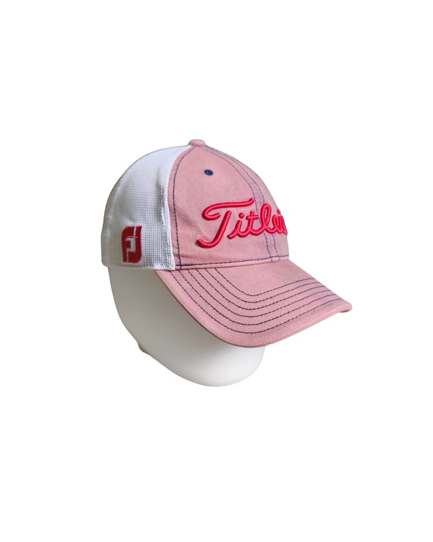 Titleist Pro V1 Golf Cap (Category: Caps & Hats) located in Davao. Submitted by dreytohan (Listing ID 1397581524, Image 1). Description: - Titleist golf cap - Pink and white color scheme - Embroidered Titleist logo on front - "Pro V1" branding on the side - Mesh back for breathability - Curved brim.