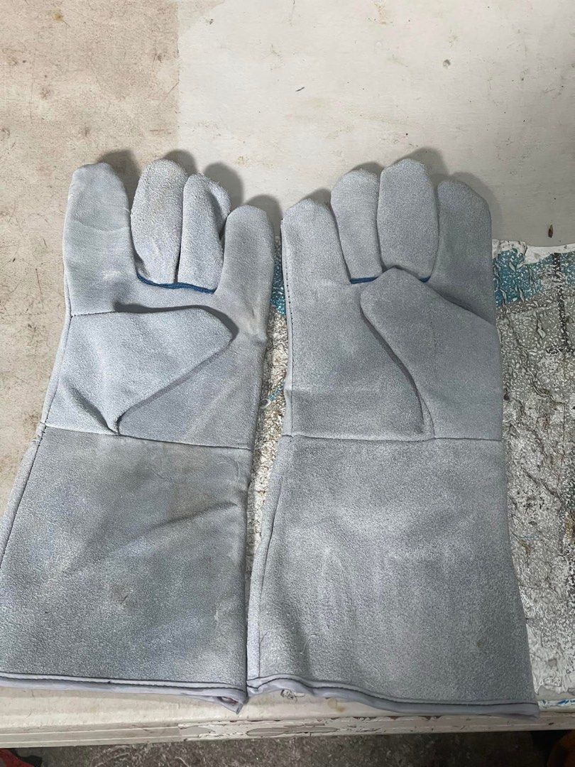 Welding Gloves - Orange and Gray (Category: Construction Tools & Equipment) located in Manila. Submitted by prinzcaba69742 (Listing ID 1397573722, Image 3). Description: - Available in orange and gray - Durable and heat-resistant material - Long cuffs for added protection - Perfect for welding and high-heat tasks - Multiple pairs available - 14 inch.