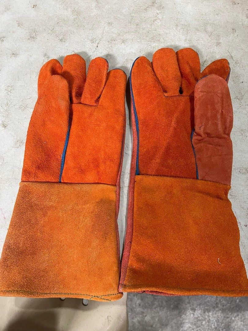 Welding Gloves - Orange and Gray (Category: Construction Tools & Equipment) located in Manila. Submitted by prinzcaba69742 (Listing ID 1397573722, Image 1). Description: - Available in orange and gray - Durable and heat-resistant material - Long cuffs for added protection - Perfect for welding and high-heat tasks - Multiple pairs available - 14 inch.