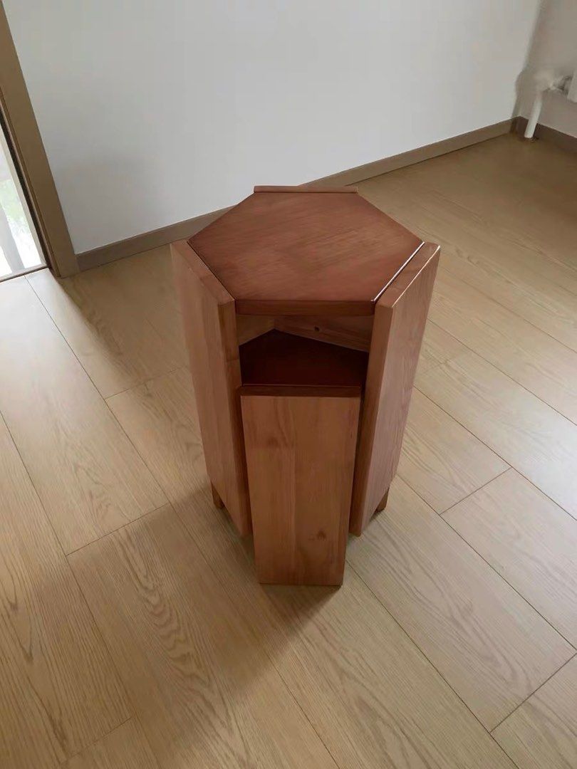Wooden Hexagonal stackable stools *2 side table (Category: Chairs) located in Singapore. Submitted by whoopss (Listing ID 1397569135, Image 3). Description: Stylish solid wooden stools with a unique hexagonal design. Two ways to stack. Compact stack takes little space to store. Elevated stack can be used as a stand or a side table. The stool is sturdy and well-crafted, adding a touch of elegance to any room. Dimensions of single stool: 32cm x 43c