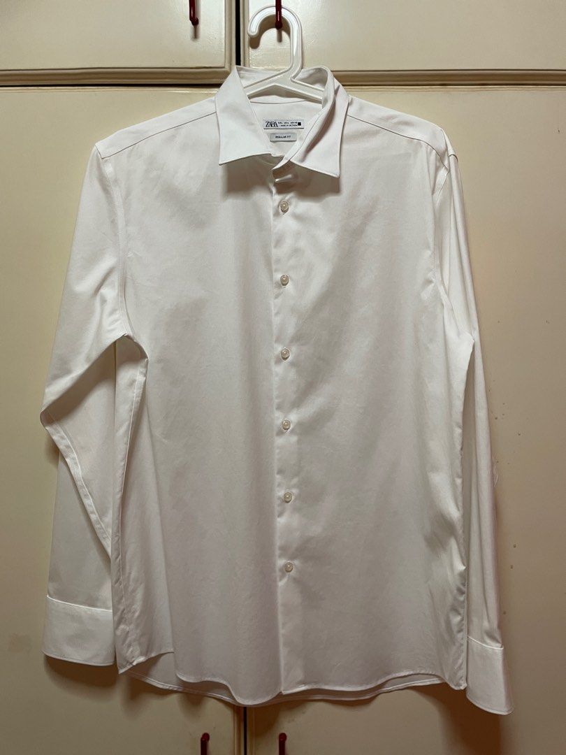 Zara Regular Fit White Shirt (Category: Tshirts & Polo Shirts ) located in Makati City. Submitted by masaca (Listing ID 1397441855, Image 1). Description: - Zara white long-sleeved shirt - Regular fit - Classic collar - Button-down front and cuffs - Size: EUR L, USAL L, MEX 42 - Made in Vietnam.